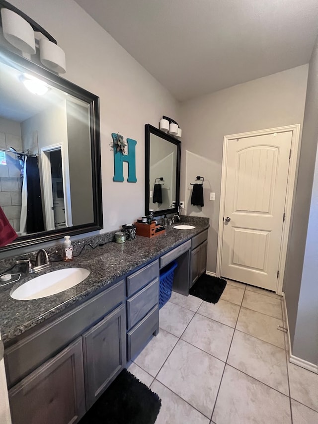 bathroom featuring tile patterned flooring, vanity, and a shower with curtain