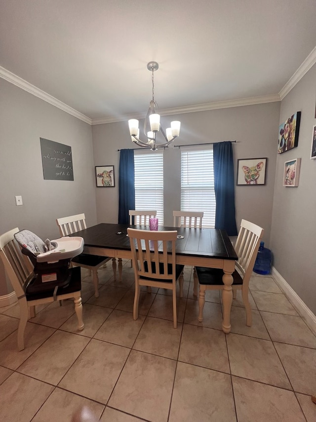 tiled dining space featuring ornamental molding and a chandelier