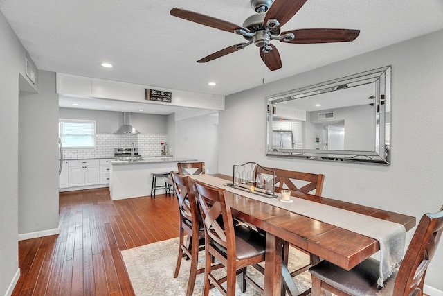 1722 Purdue Ave, Big Spring, TX 79720 - dining space featuring ceiling fan, dark wood-style floors, recessed lighting, and baseboards