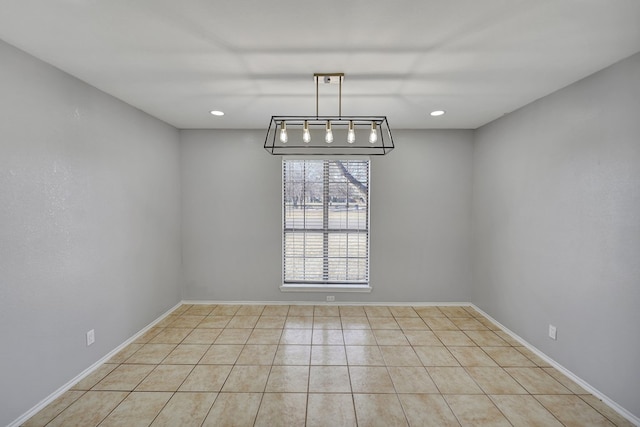 unfurnished dining area featuring recessed lighting, baseboards, and light tile patterned floors