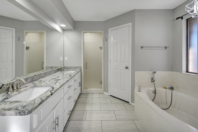 full bathroom with double vanity, a sink, a shower stall, a garden tub, and tile patterned floors