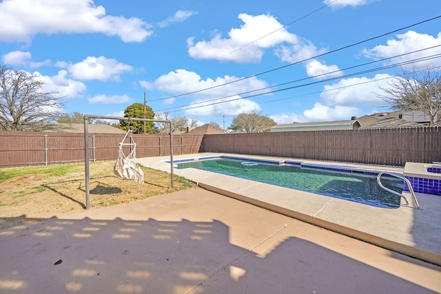 view of pool featuring a patio, a fenced backyard, and a fenced in pool