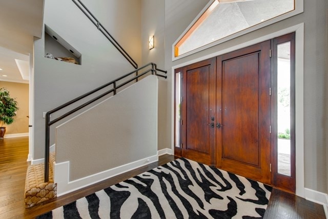 entrance foyer with dark hardwood / wood-style flooring