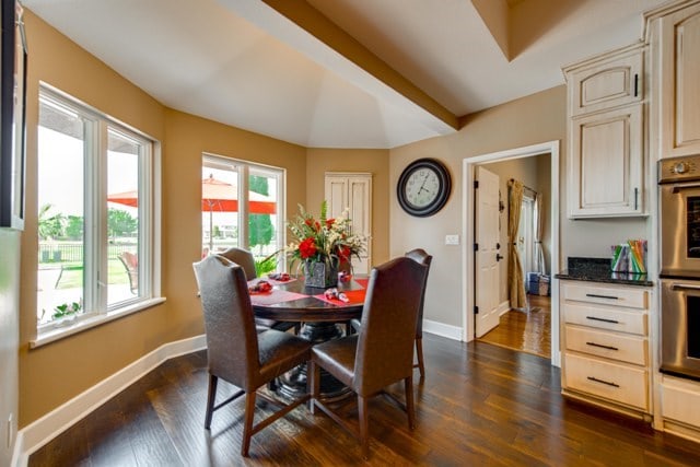 dining space featuring dark hardwood / wood-style floors