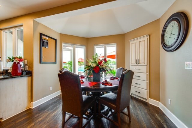 dining space featuring dark hardwood / wood-style flooring