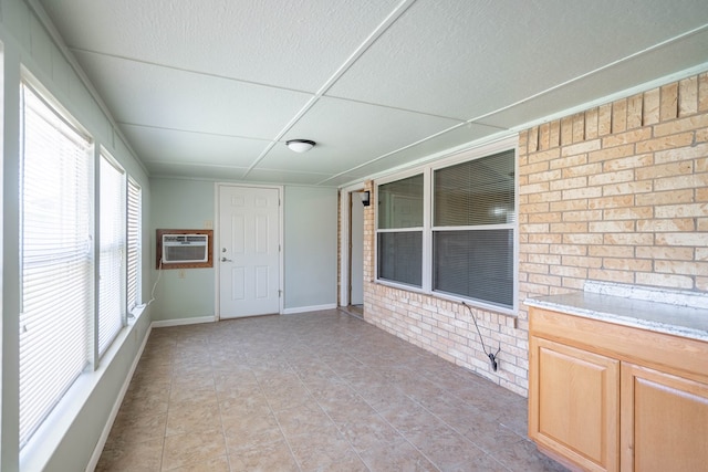 1509 Cascade Ct, Midland, TX 79703 - unfurnished sunroom featuring a wall mounted AC