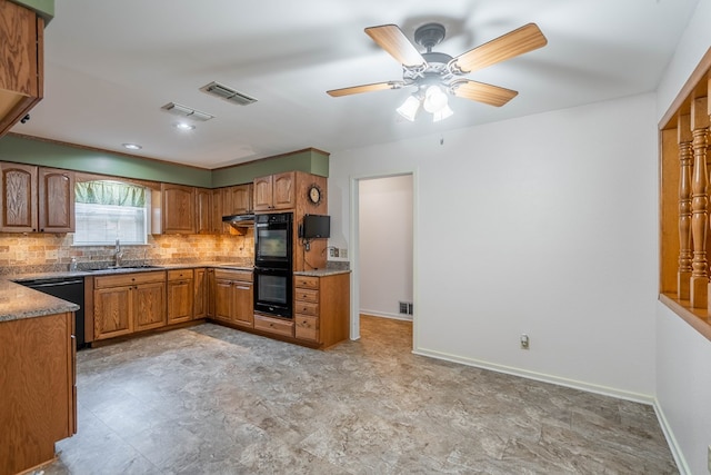1509 Cascade Ct, Midland, TX 79703 - kitchen with black appliances, backsplash, brown cabinets, ceiling fan, and under cabinet range hood