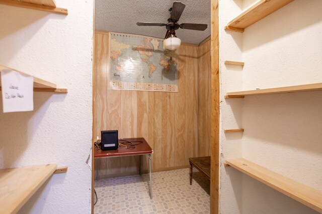 1509 Cascade Ct, Midland, TX 79703 - spacious closet featuring a ceiling fan and tile patterned floors