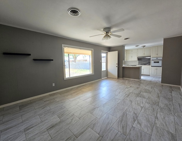 unfurnished living room with ceiling fan