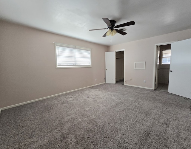 unfurnished bedroom with carpet flooring, ceiling fan, and multiple windows