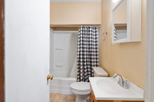 bathroom with vanity, shower / bath combo, tile patterned flooring, and toilet