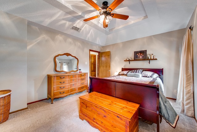10903 E County Rd 105, Midland, TX 79706 - bedroom featuring carpet flooring, a tray ceiling, baseboards, and ceiling fan