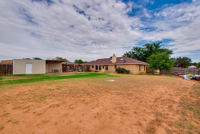 10903 E County Rd 105, Midland, TX 79706 - view of yard with an outbuilding and an outdoor structure