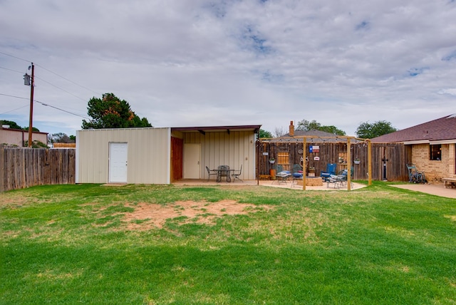 10903 E County Rd 105, Midland, TX 79706 - view of yard featuring a patio area, an outdoor fire pit, and an outdoor structure