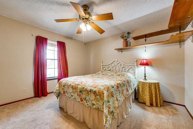 10903 E County Rd 105, Midland, TX 79706 - bedroom with light carpet, baseboards, a ceiling fan, and a textured ceiling
