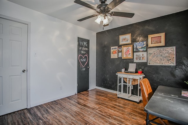 3405 44th St, Snyder, TX 79549 - office area with baseboards, wood finished floors, ceiling fan, and an accent wall
