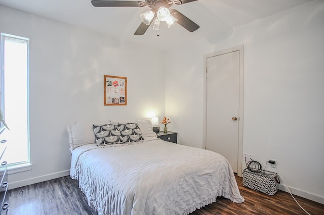 3405 44th St, Snyder, TX 79549 - bedroom featuring baseboards, ceiling fan, and wood finished floors