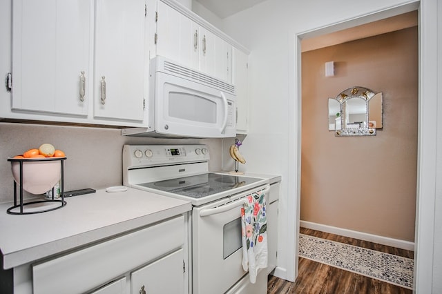 3405 44th St, Snyder, TX 79549 - kitchen featuring white appliances, light countertops, white cabinets, and dark wood-style flooring