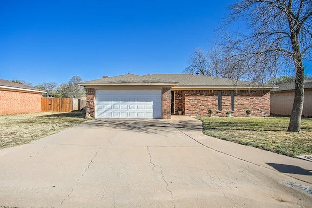 3405 44th St, Snyder, TX 79549 - single story home featuring fence, a garage, brick siding, a front lawn, and driveway