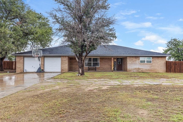 single story home with concrete driveway, an attached garage, fence, a front lawn, and brick siding