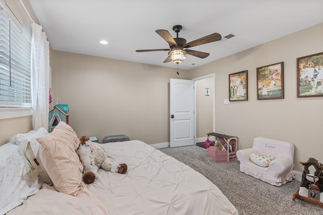 carpeted bedroom with a ceiling fan, recessed lighting, visible vents, and baseboards