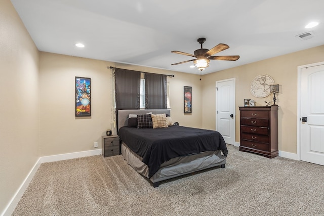 bedroom featuring ceiling fan, recessed lighting, light colored carpet, visible vents, and baseboards