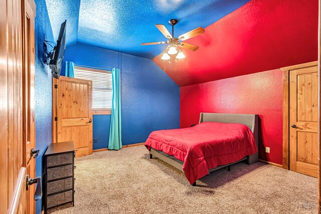 10500 E County Rd 90, Midland, TX 79706 - carpeted bedroom featuring vaulted ceiling, a textured wall, a textured ceiling, baseboards, and a ceiling fan