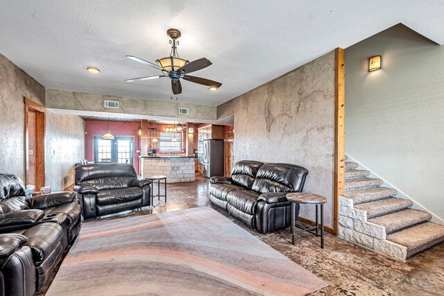 10500 E County Rd 90, Midland, TX 79706 - living area featuring ceiling fan and a textured ceiling