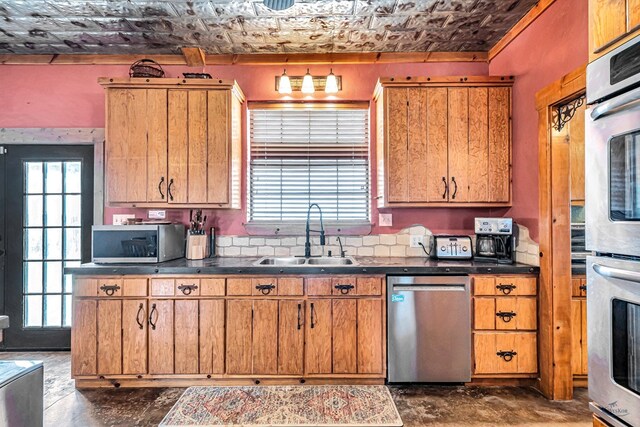 10500 E County Rd 90, Midland, TX 79706 - kitchen with stainless steel appliances, a sink, and healthy amount of natural light
