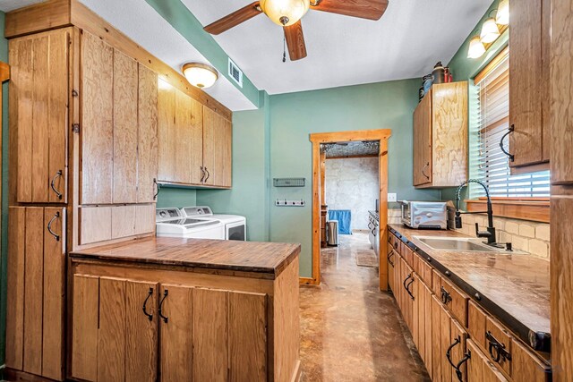 10500 E County Rd 90, Midland, TX 79706 - kitchen with washer and clothes dryer, a sink, a ceiling fan, and butcher block countertops
