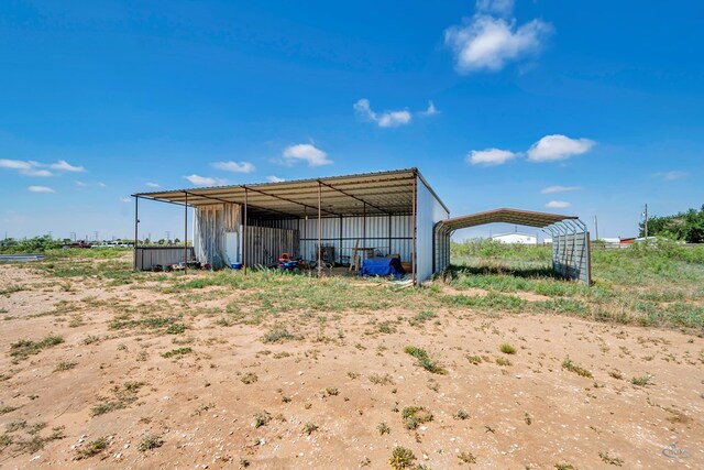 10500 E County Rd 90, Midland, TX 79706 - view of pole building featuring a carport
