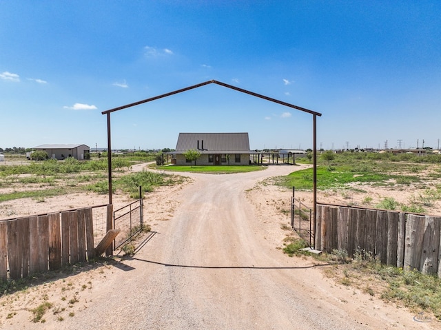 10500 E County Rd 90, Midland, TX 79706 - view of dirt / gravel driveway featuring a gated entry
