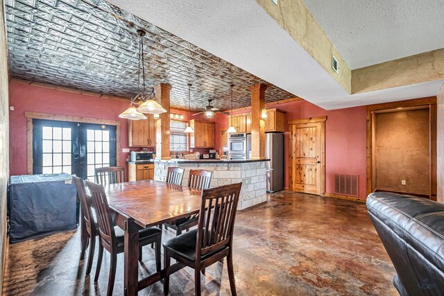 10500 E County Rd 90, Midland, TX 79706 - dining room with plenty of natural light, ceiling fan, and concrete floors