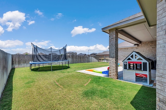 6003 Sunny Stone Dr, Midland, TX 79705 - fenced backyard with a trampoline and a patio