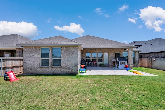 6003 Sunny Stone Dr, Midland, TX 79705 - rear view of property with a patio, a fenced backyard, brick siding, and a shingled roof
