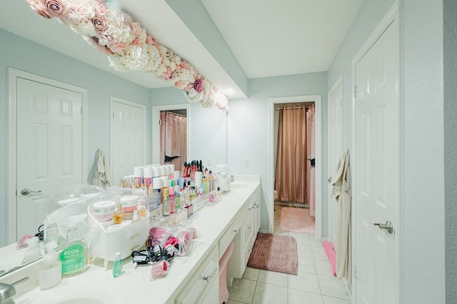 5000 Thames Ct, Midland, TX 79705 - full bathroom with double vanity and tile patterned floors