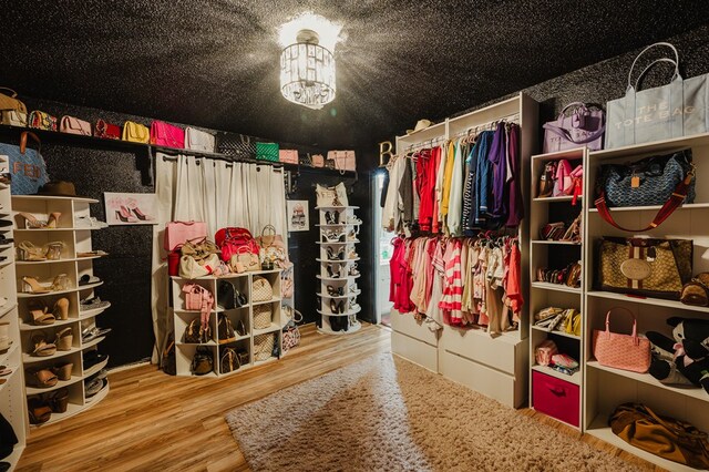 5000 Thames Ct, Midland, TX 79705 - spacious closet with wood finished floors and a chandelier
