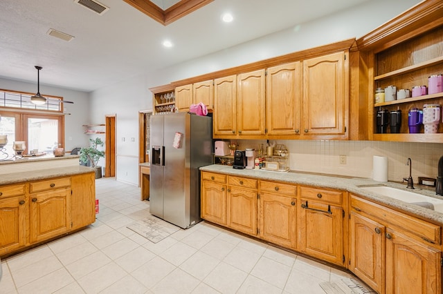 5000 Thames Ct, Midland, TX 79705 - kitchen with stainless steel refrigerator with ice dispenser, a sink, recessed lighting, tasteful backsplash, and hanging light fixtures