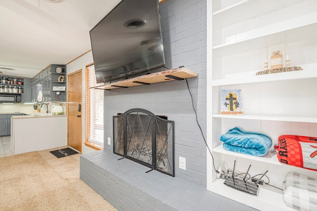 tiled living room with a brick fireplace and indoor wet bar