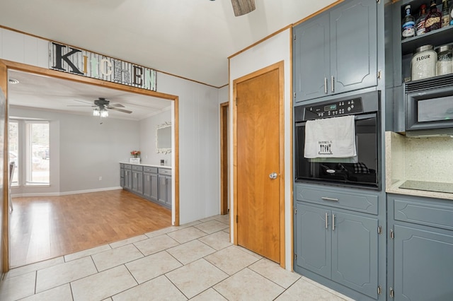 kitchen featuring black appliances, crown molding, light tile patterned flooring, and ceiling fan