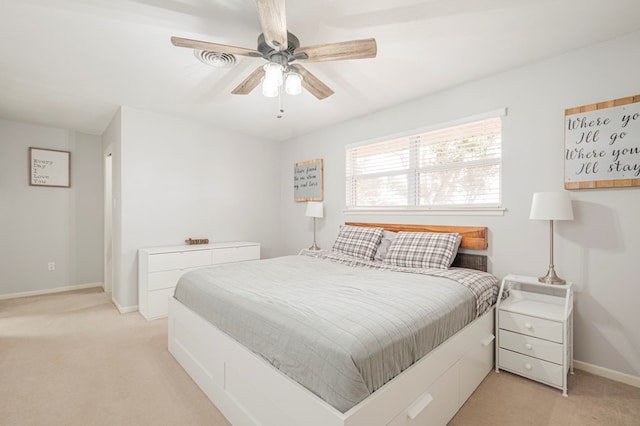 bedroom featuring ceiling fan and light colored carpet