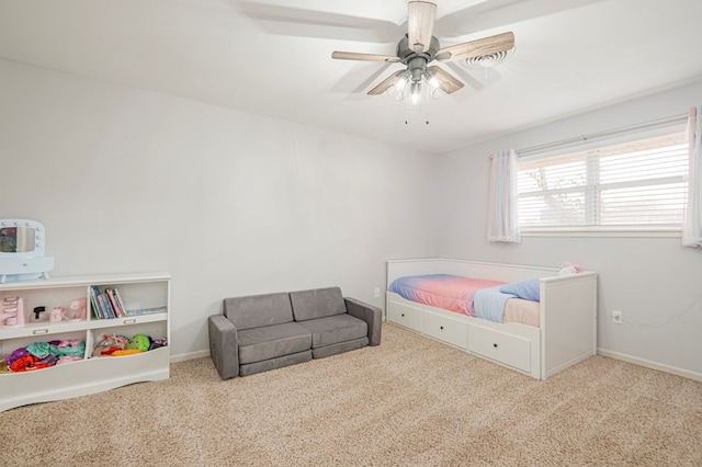 carpeted bedroom featuring ceiling fan