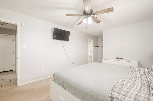 bedroom featuring light carpet and ceiling fan