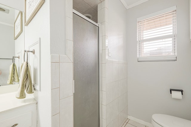 bathroom featuring vanity, crown molding, toilet, and walk in shower