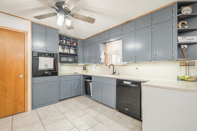 kitchen featuring ceiling fan, decorative backsplash, sink, and black appliances