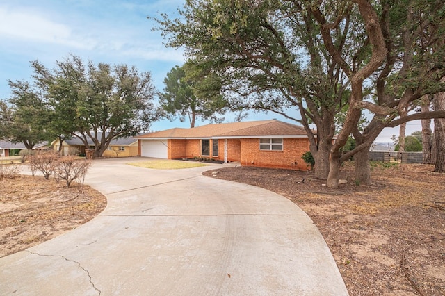 ranch-style house featuring a garage