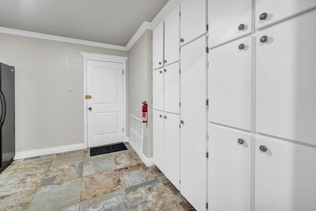 2406 Stutz Pl, Midland, TX 79705 - mudroom with crown molding and stone finish flooring