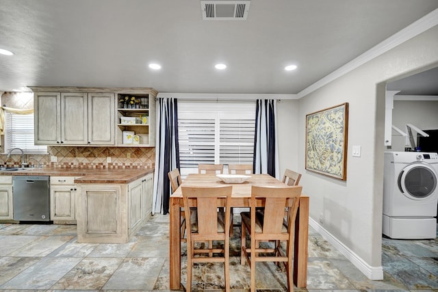 2406 Stutz Pl, Midland, TX 79705 - dining space with washer / dryer, ornamental molding, light stone finish flooring, and recessed lighting