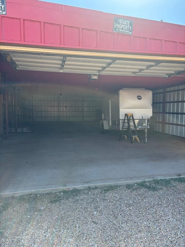 297 County Rd 221, Snyder, TX 79549 - garage featuring a garage door opener