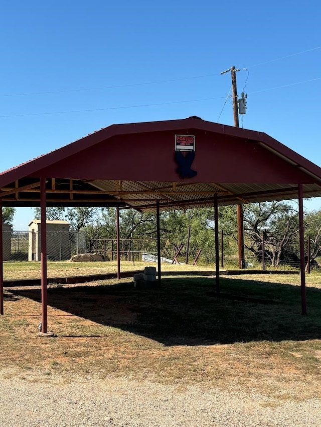 297 County Rd 221, Snyder, TX 79549 - view of parking / parking lot with a carport